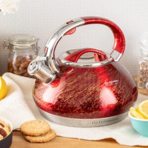 Czajnik z gwizdkiem 3.5L Edenberg w kolorze czerwono-złotym, wykonany z wysokiej jakości stali nierdzewnej, idealny do każdej kuchni.